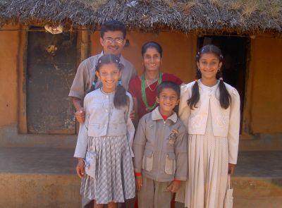Damodar Thapa in Nepal with wife and children